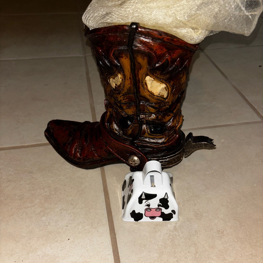 Brown boot decoration and cow bell
